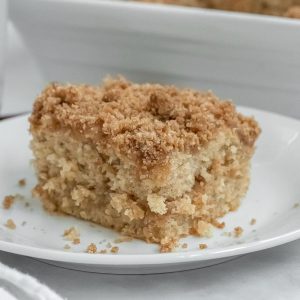 closeup of a square slice of coffee cake a on a white plate