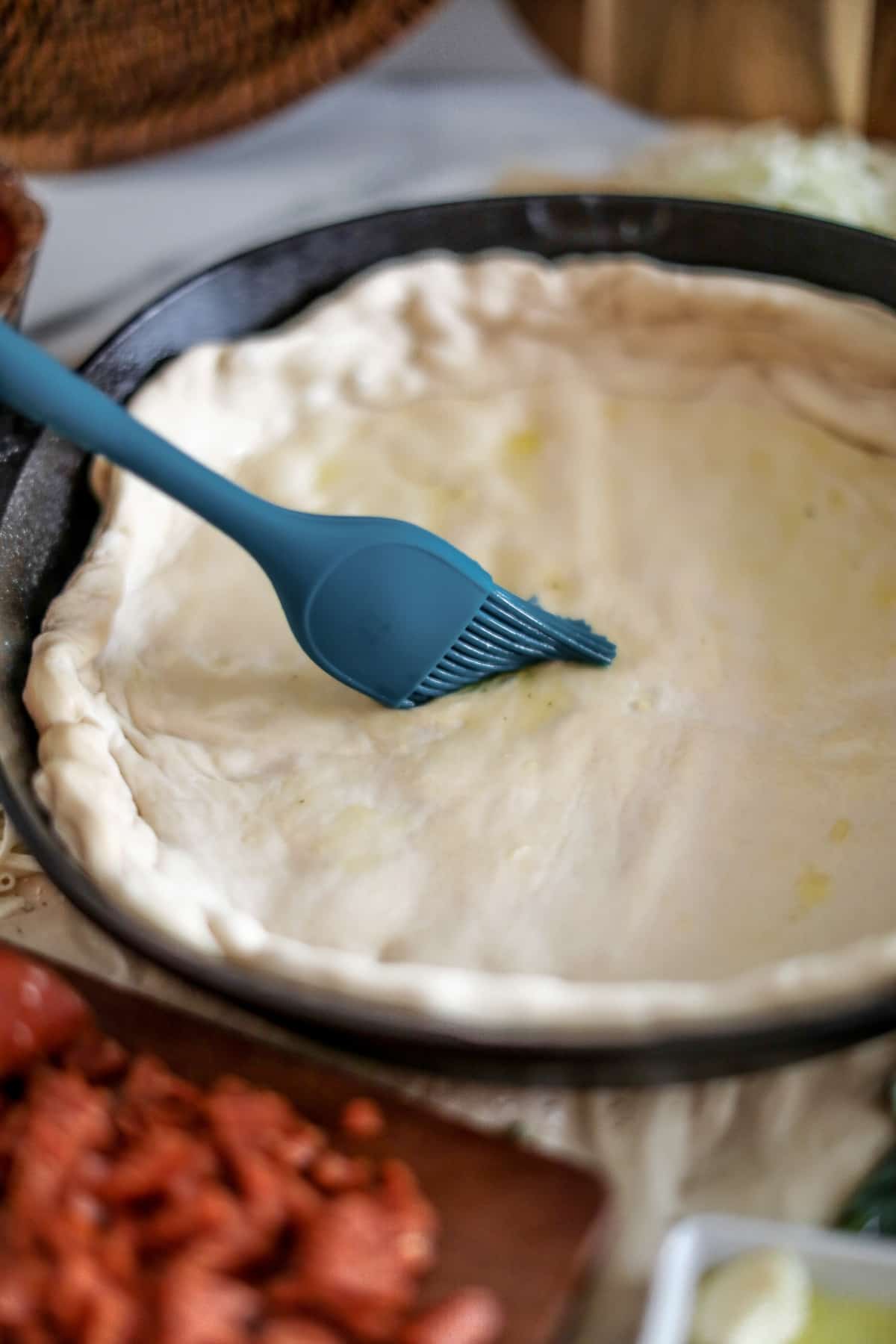 brush dough with oil and garlic