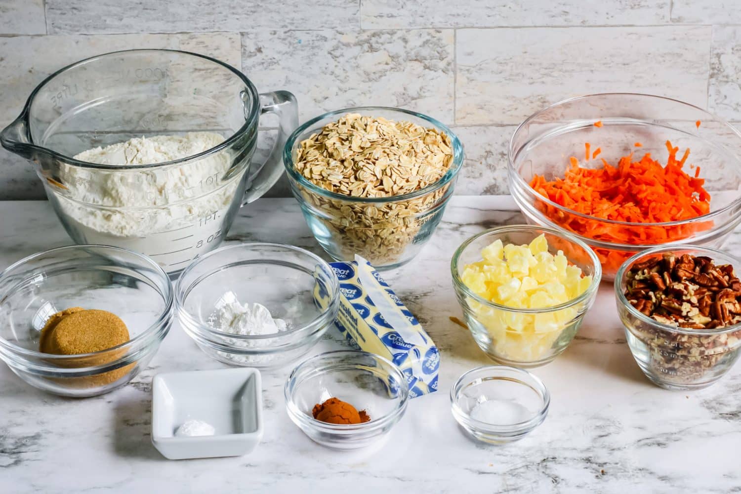 Ingredients for carrot cookies in bowls.