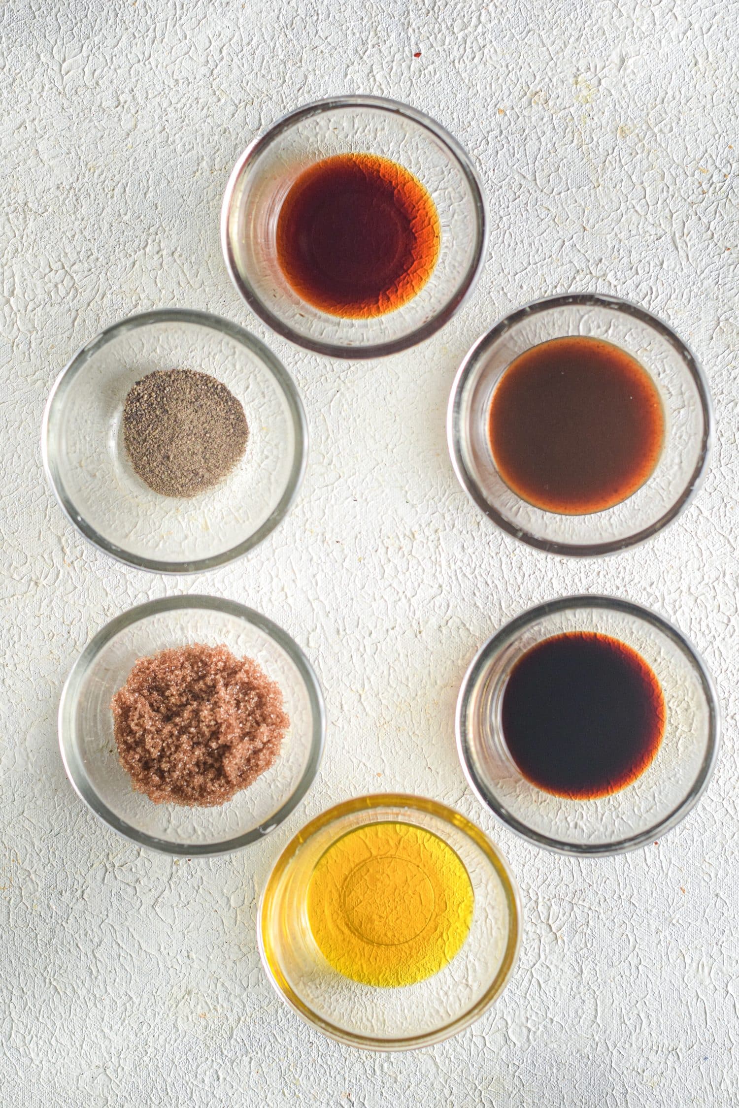 sauces in glass ramikens on table