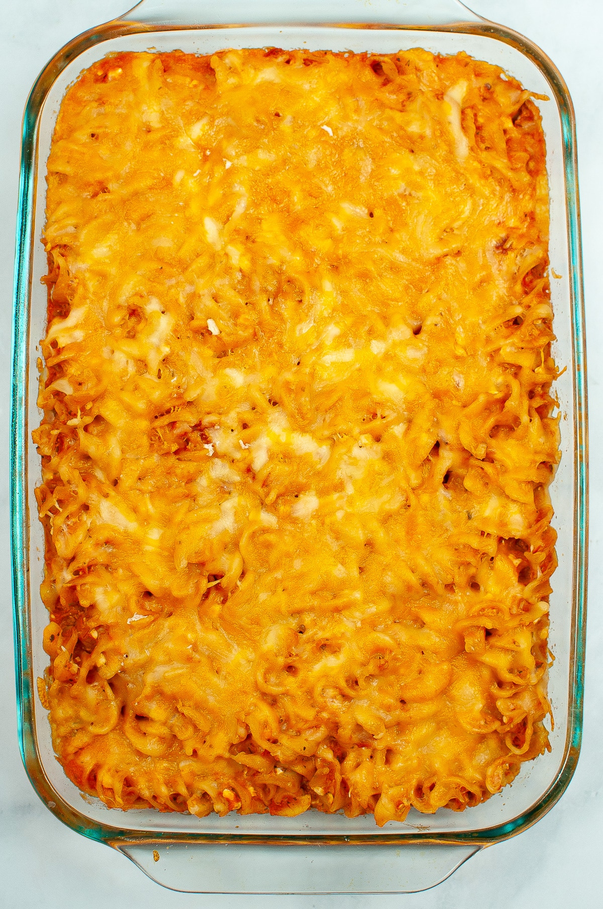 Cheesy rotini bake pasta in a casserole dish from above after baking.
