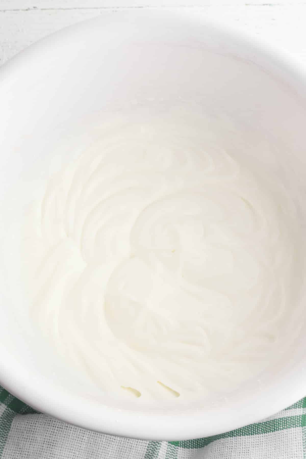white bowl of whipped heavy whipping cream.
